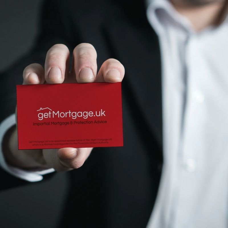 man holding business card